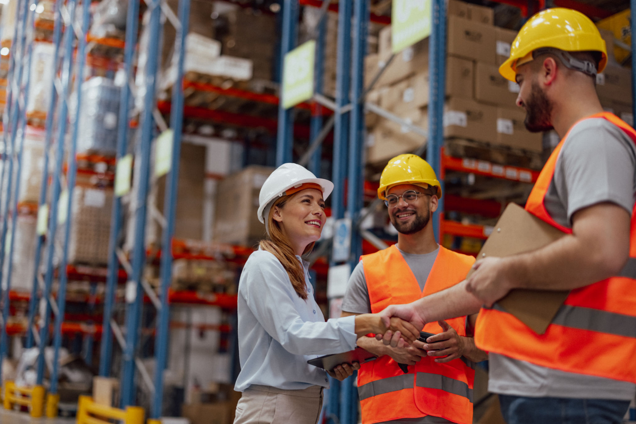 Warehouse manager shaking hands with a team member